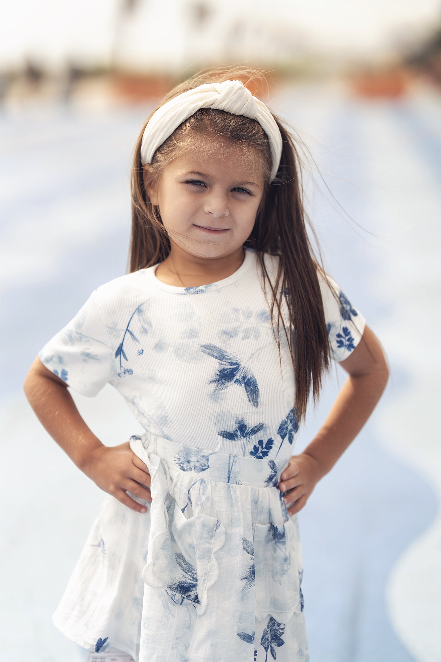 Blue Flower Skirt worn by a girl in a white and blue floral outfit with a white headband.