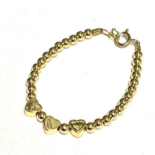 14KT gold heart bracelet with beaded chain and three heart charms, lobster clasp.