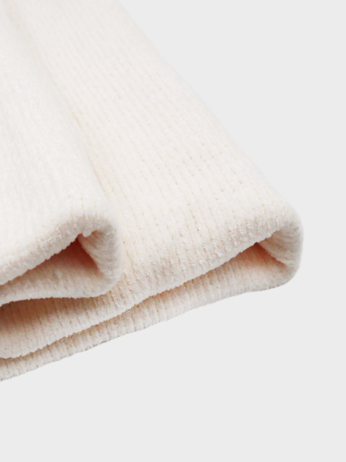soft off-white chenille fabric Blanket in pink and brown accents.