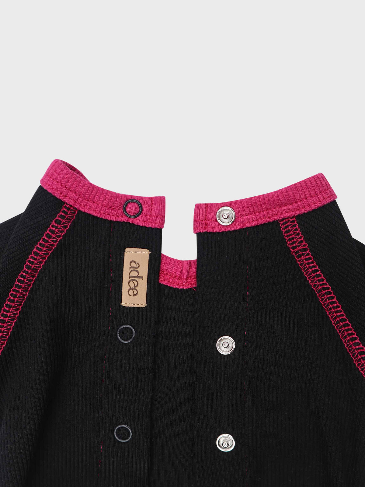 Baby jumpsuit with pink V-neck