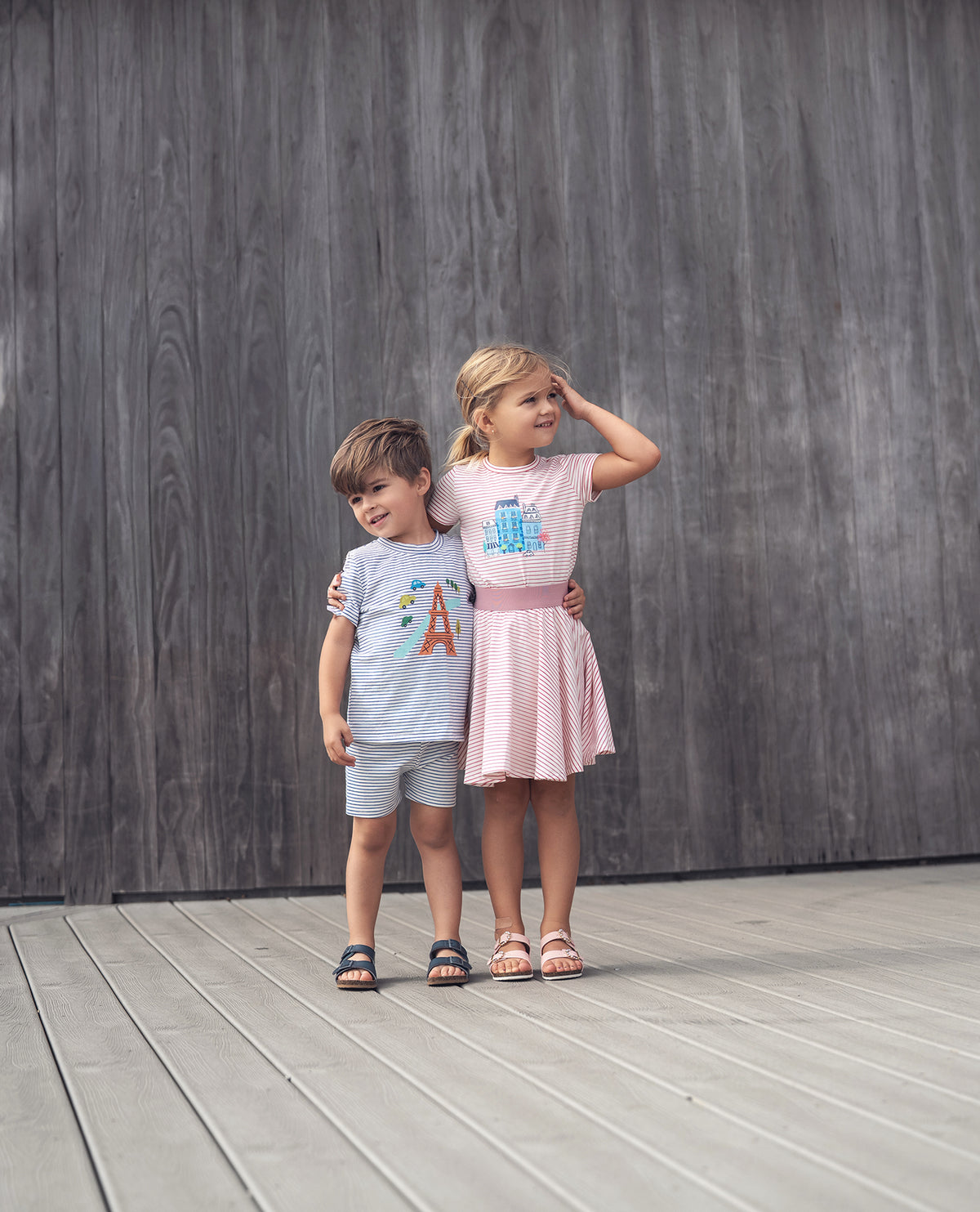 Striped Pink Skirt for girls by Adee; two children in matching striped outfits pose against a wooden backdrop.