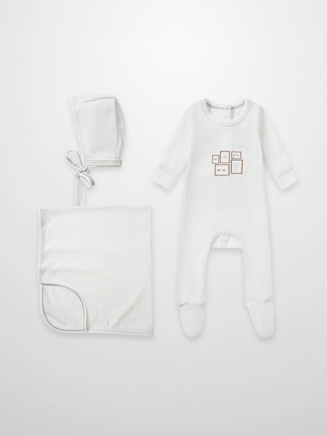 Mini Gallery Blue layette set by Adee; white 3-piece newborn outfit with blue stitching: hat, blanket, footed sleeper.