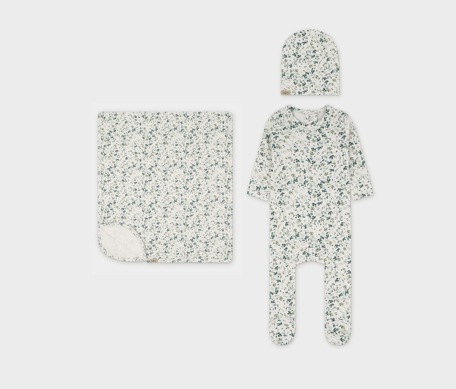 Soft and stylish baby layette set featuring a delicate leaf print design.