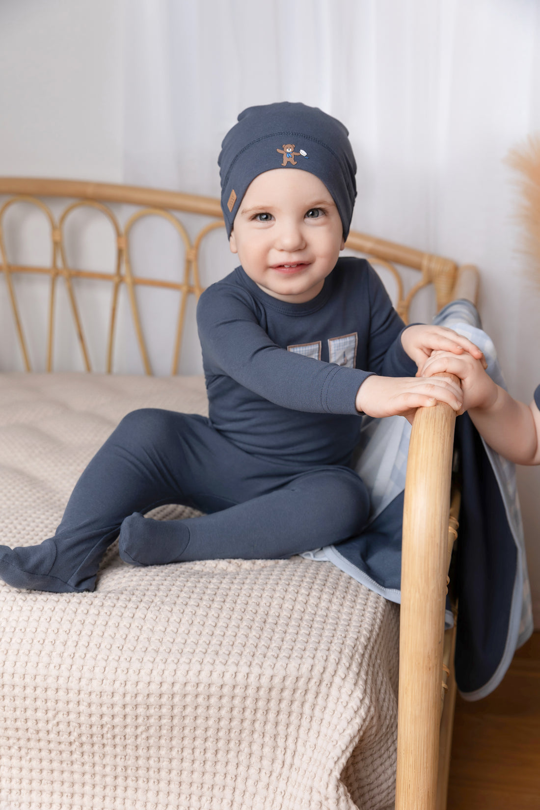 Blue Teddy Frame Stretchy baby jumpsuit with three photo-frame patches featuring anchor, teddy bear, sailboat.