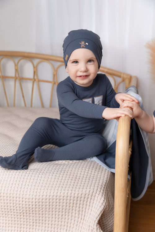 Blue Teddy Frame Stretchy baby jumpsuit with three photo-frame patches featuring anchor, teddy bear, sailboat.