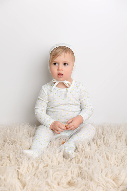 Lemon Window Stretchy boys stretchies by Adee on a crisp white base with yellow lemon dots.