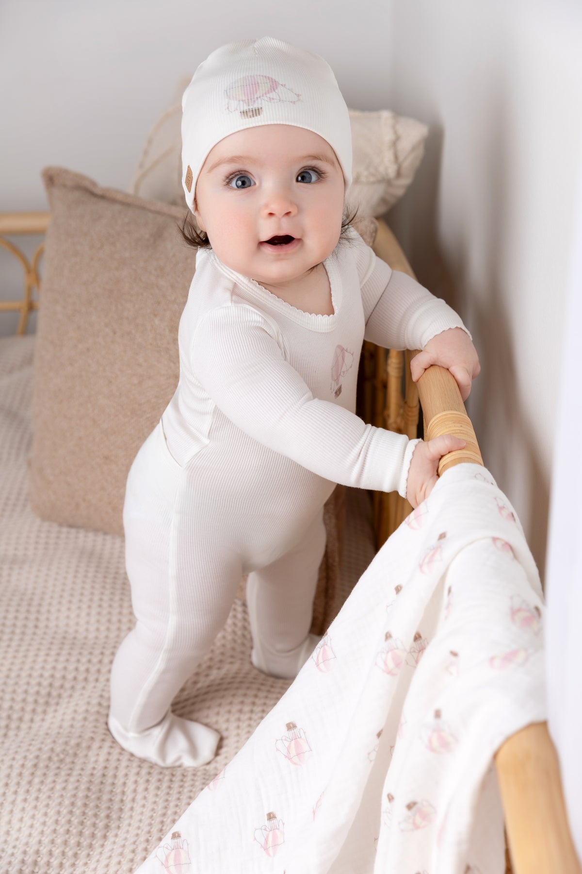 Pink Balloon Stretchy With Lace girls stretchies white footed jumpsuit worn by a baby